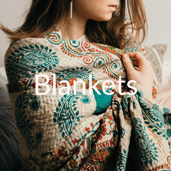 Buy a blanket for yourself, provide an income for a woman in need